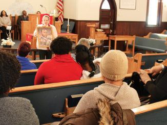 Congregation listens to speaker discussing MLK